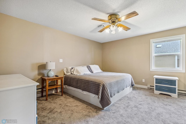 carpeted bedroom featuring baseboards, ceiling fan, a baseboard heating unit, and a textured ceiling