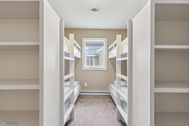 walk in closet featuring carpet and visible vents