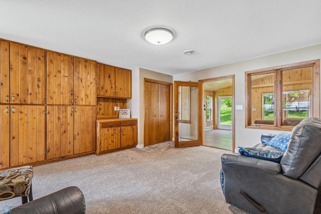 living room with light colored carpet and visible vents