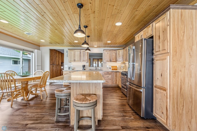 kitchen featuring recessed lighting, dark wood-style flooring, a sink, appliances with stainless steel finishes, and light brown cabinetry