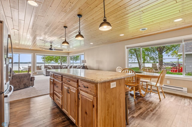 kitchen featuring a center island, dark wood-style flooring, open floor plan, wooden ceiling, and stainless steel fridge with ice dispenser