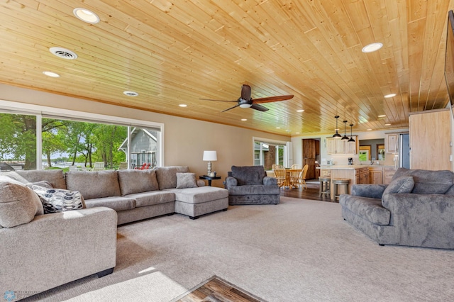 carpeted living room with plenty of natural light, wood ceiling, visible vents, and recessed lighting