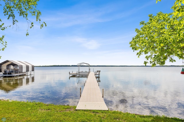 dock area with a water view and boat lift