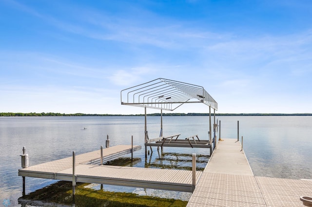 view of dock with a water view and boat lift