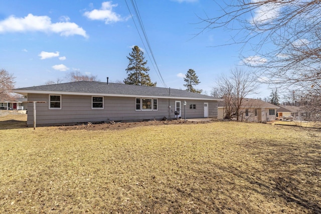 back of house featuring a yard