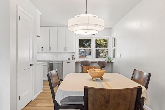 dining area with light wood-type flooring