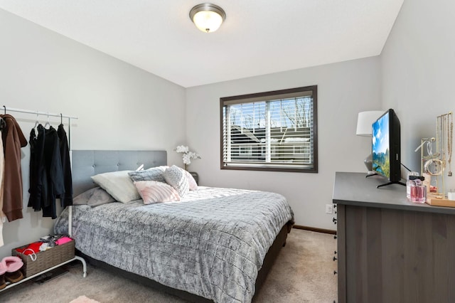 carpeted bedroom with baseboards