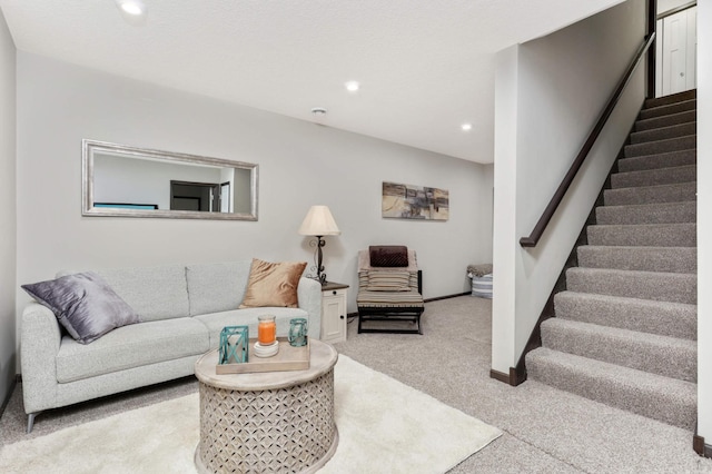 carpeted living room featuring recessed lighting, stairway, and baseboards