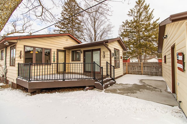 view of front of house featuring a patio area and fence