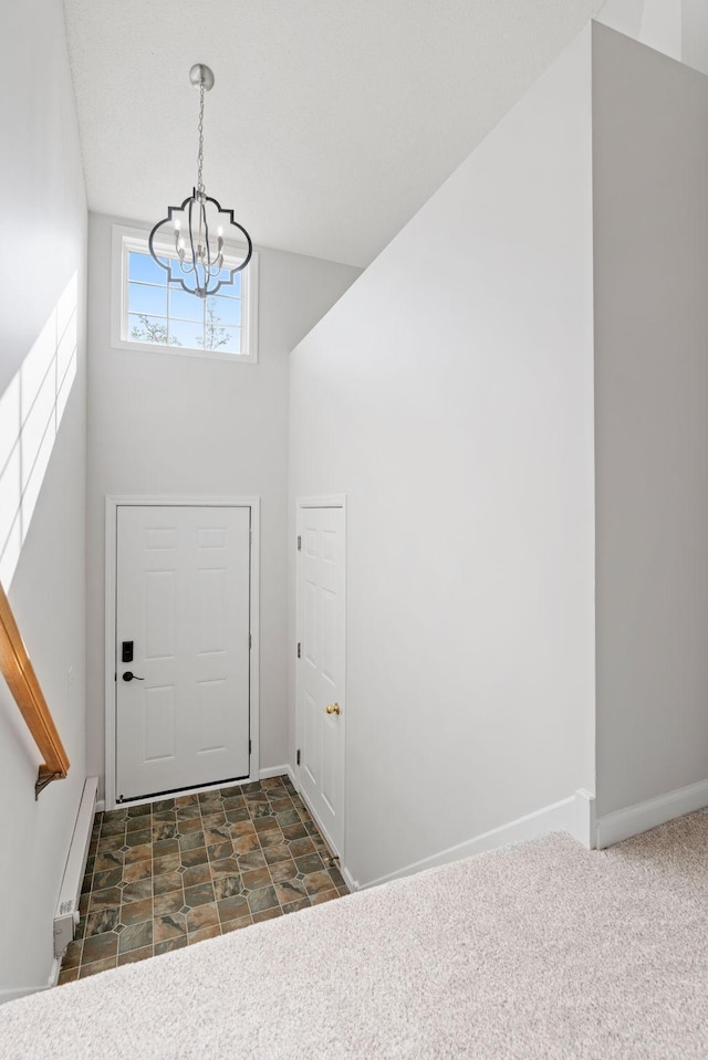 15721 France Way Unit 1312, Apple Valley, MN 55124 - entrance foyer featuring a notable chandelier, baseboards, baseboard heating, and stone finish floor