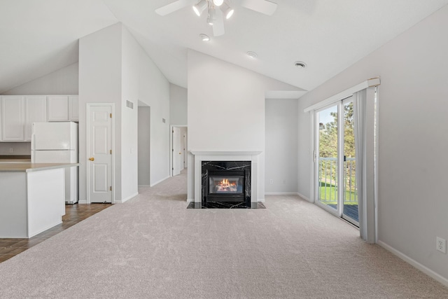 15721 France Way Unit 1312, Apple Valley, MN 55124 - unfurnished living room featuring a premium fireplace, baseboards, ceiling fan, and carpet