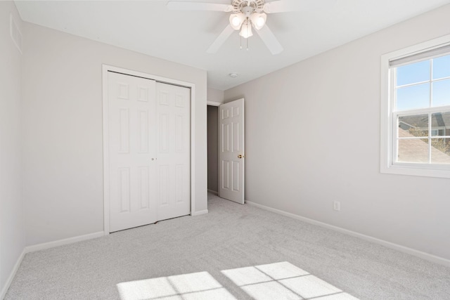 15721 France Way Unit 1312, Apple Valley, MN 55124 - unfurnished bedroom featuring light carpet, a closet, baseboards, and a ceiling fan