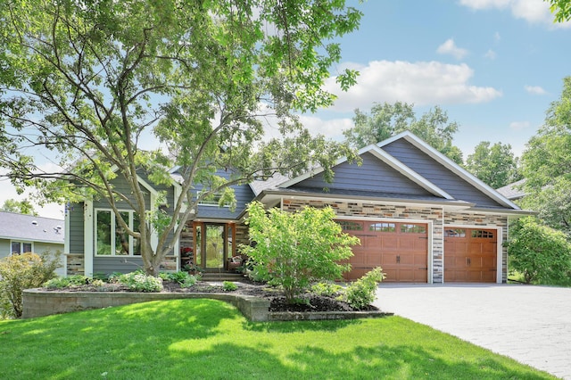 11259 71st Ave N, Maple Grove, MN 55369 - view of front facade with a front lawn, driveway, and an attached garage