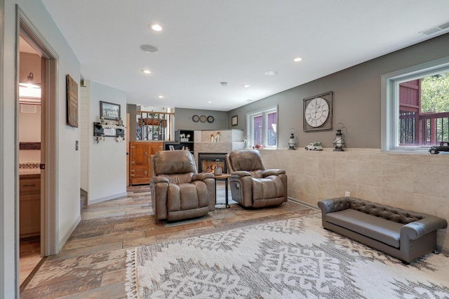 11259 71st Ave N, Maple Grove, MN 55369 - living room with light wood finished floors, recessed lighting, and a glass covered fireplace