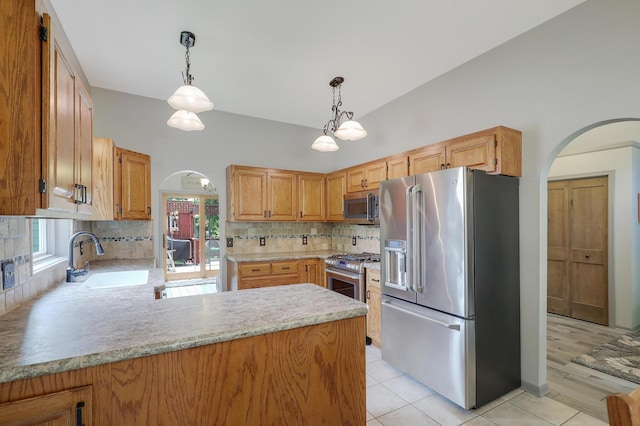 11259 71st Ave N, Maple Grove, MN 55369 - kitchen featuring appliances with stainless steel finishes, arched walkways, a sink, and light countertops