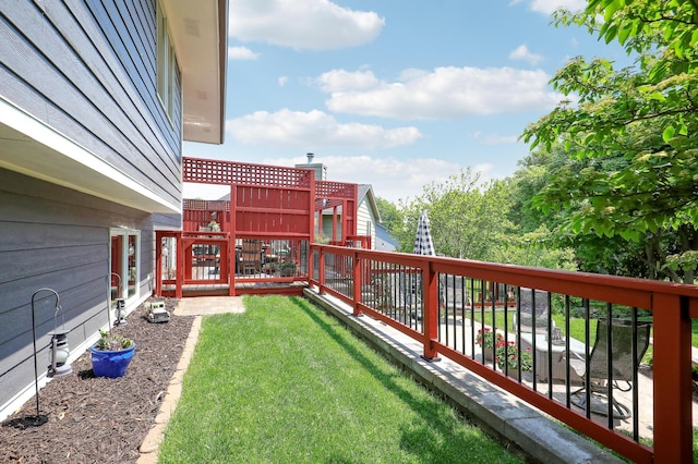 11259 71st Ave N, Maple Grove, MN 55369 - view of grassy yard with a balcony