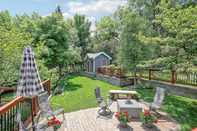 11259 71st Ave N, Maple Grove, MN 55369 - view of patio / terrace with an outdoor structure and view of wooded area