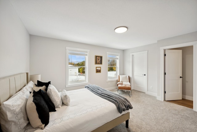 bedroom featuring carpet floors and baseboards