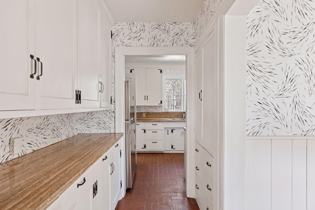 2148 Delaware Ave, Sunfish Lake, MN 55118 - bathroom featuring brick patterned flooring, vanity, and wallpapered walls