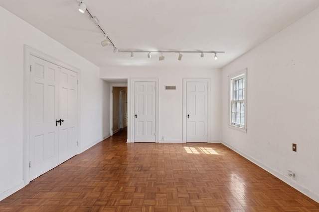 2148 Delaware Ave, Sunfish Lake, MN 55118 - unfurnished bedroom with two closets, baseboards, and rail lighting