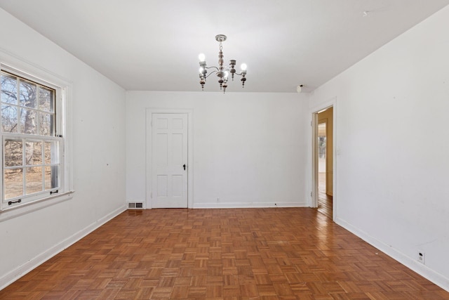 2148 Delaware Ave, Sunfish Lake, MN 55118 - spare room featuring a chandelier and baseboards