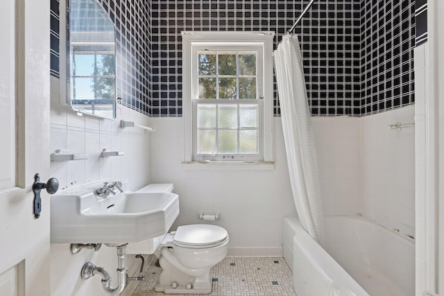 2148 Delaware Ave, Sunfish Lake, MN 55118 - bathroom with tile walls, plenty of natural light, toilet, shower / bath combo with shower curtain, and tile patterned flooring