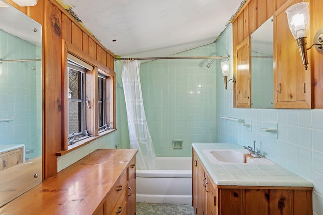2148 Delaware Ave, Sunfish Lake, MN 55118 - full bathroom with vanity, shower / tub combo, tile walls, tasteful backsplash, and lofted ceiling