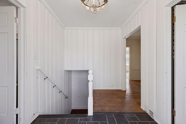 2148 Delaware Ave, Sunfish Lake, MN 55118 - staircase featuring hardwood / wood-style flooring, a chandelier, and a decorative wall