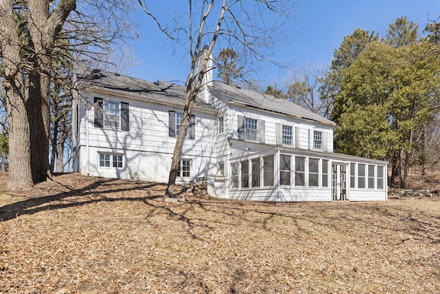 2148 Delaware Ave, Sunfish Lake, MN 55118 - back of property with a sunroom and solar panels