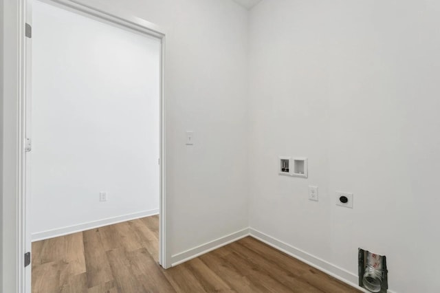 washroom with wood finished floors, baseboards, laundry area, electric dryer hookup, and washer hookup