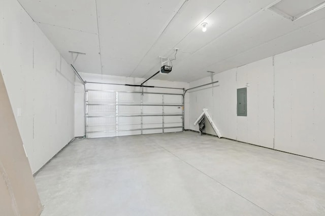 garage featuring electric panel and a garage door opener