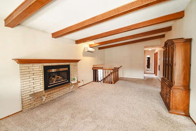 unfurnished living room featuring beam ceiling, carpet flooring, a fireplace, and an AC wall unit