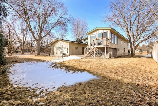 back of house featuring stairway