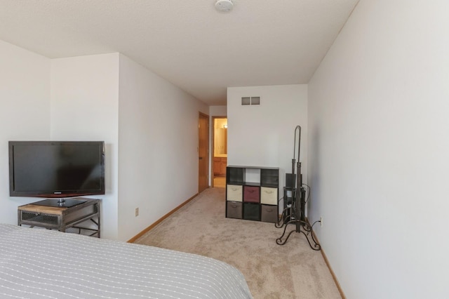 bedroom featuring visible vents, carpet flooring, and baseboards