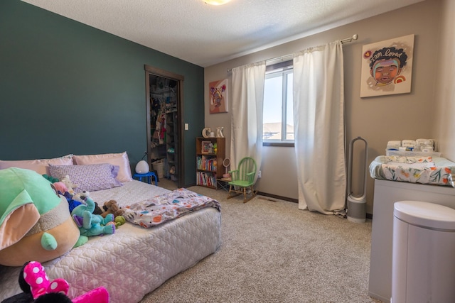 carpeted bedroom with a textured ceiling