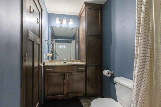 bathroom with tile patterned floors, vanity, toilet, and a shower with curtain