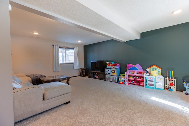 rec room with carpet, a textured ceiling, and recessed lighting