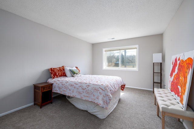 bedroom with a textured ceiling, carpet, visible vents, and baseboards