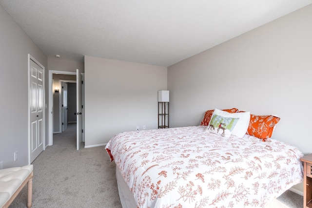 carpeted bedroom with baseboards