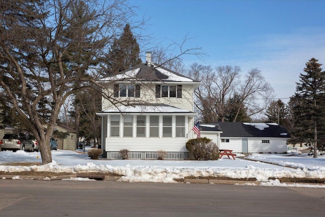 view of front facade with an outbuilding and a garage