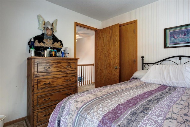 carpeted bedroom with baseboards