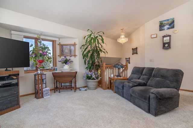 living area with baseboards, carpet flooring, lofted ceiling, and an inviting chandelier