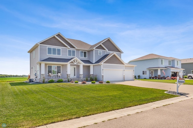 craftsman-style home with driveway, a front lawn, and cooling unit