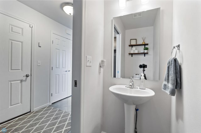 bathroom with tile patterned flooring and visible vents