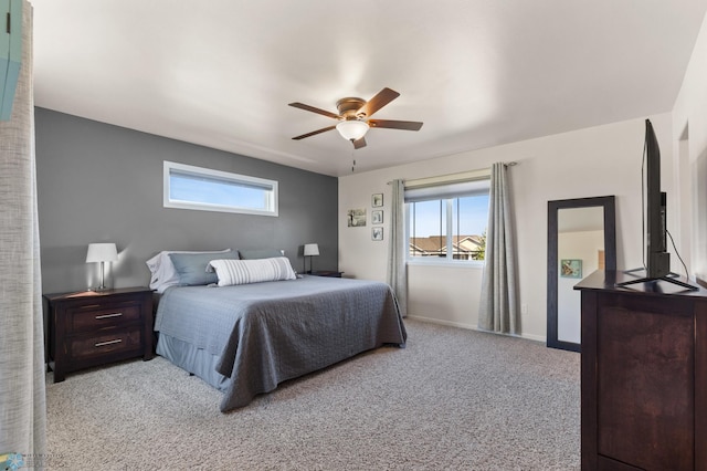 bedroom featuring carpet floors, baseboards, and a ceiling fan