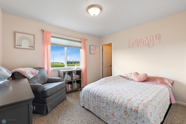 bedroom featuring carpet flooring and baseboards