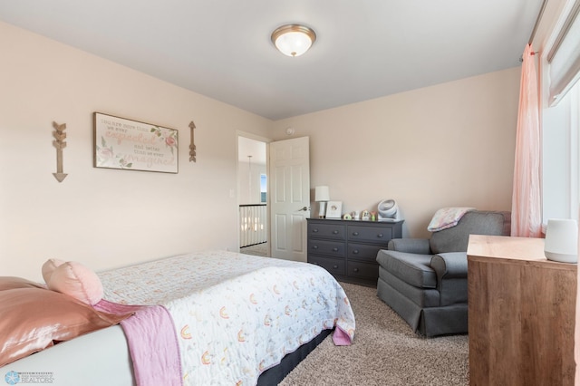 bedroom featuring carpet