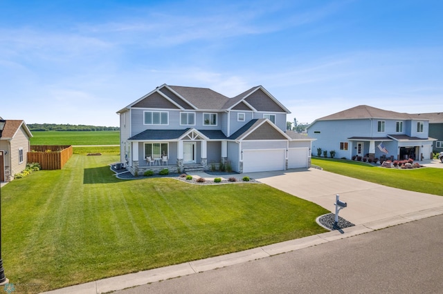 craftsman house featuring driveway and a front lawn