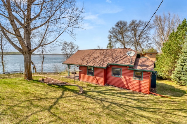 47166 Franklin Ct, Dunn Twp, MN 56572 - rear view of property with a water view, log veneer siding, a shingled roof, and a lawn