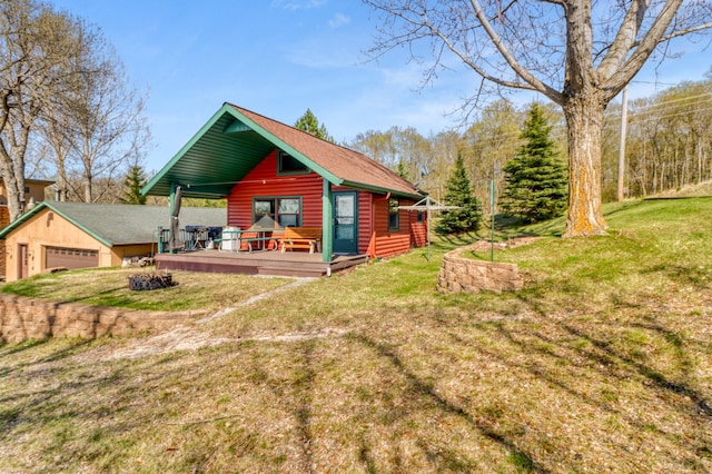 47166 Franklin Ct, Dunn Twp, MN 56572 - back of house with log veneer siding, a garage, a lawn, and a wooden deck